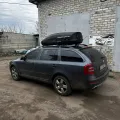 Фото 1: Автобокс на крышу автомобиля Terra Drive 440 черный матовый двусторонний (на фото пример установки на  ). Цвет: Черный матовый.