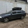 Как выглядит Автобокс на крышу автомобиля Terra Drive 440 черный матовый двусторонний в салоне (на примере  ) – фото 2.