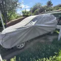 Як виглядає Чохол-тент для автомобіля Kegel для DACIA Duster Basic Garage L SUV/Off Road (5-3968-241-3021) в салоні (на прикладі SSANGYONG ACTYON) – фото 2.