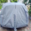 Как выглядит Чехол-тент для автомобиля Kegel для DAEWOO Nexia Hatchback Mobile Garage L1 Hatchback/Combi (5-4103-248-3020)  в салоне (на примере SKODA ROOMSTER) – фото 2.