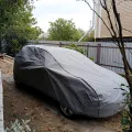 Фото 1: Чохол-тент для автомобіля Kegel для FORD Focus I hatchback/kombi Basic Garage L1 Hatchback/Combi (5-3956-241-3021) (на фото приклад встановлення на VOLKSWAGEN GOLF). Колір: Сірий.
